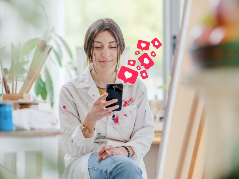 An artist is engaging with her follower on social media